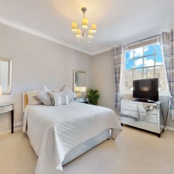 double bedroom with mirror, side table, tv and drawers, Grosvenor Square Apartments, Mayfair, London W1