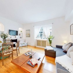 living room with dining area, wood table, sofa bed, Grosvenor Square Apartments, Mayfair, London W1