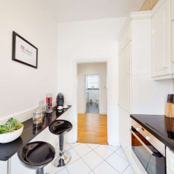 kitchen with breakfast bar and stools, Grosvenor Square Apartments, Mayfair, London W1