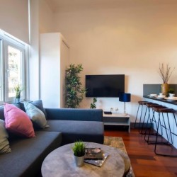 corner sofa, smart tv and kitchen with breakfast bar, The Executive Apartments, Kensington, London W8