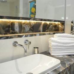bathroom with sind and stack of towels, St Johns Apartments, St Johns Wood, London NW8