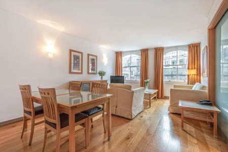 living room with dining table, sofa, wood floor and large windows, King's Apartments, City, London EC4
