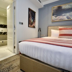 bedroom with king sizfe bed and view to bathroom, St Johns Apartments, St Johns Wood, London NW8