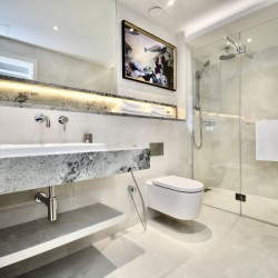 large modern bathroom with double sink, toilet and cabinet with rainfall shower, St Johns Apartments, St Johns Wood, London NW8