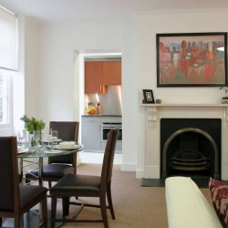 living room with dining area, view to kitchen, sofa and fireplace, King's Apartments, City, London EC4