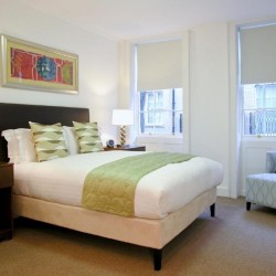 bedroom with double bed, side table and chair, King's Apartments, City, London EC4
