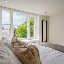 bedroom with large bed and view to garden square, King Street Deluxe, Covent Garden, London WC2