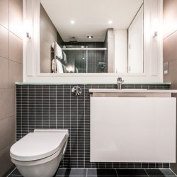 bathroom with toilet, sink and mirror, King Street Deluxe, Covent Garden, London WC2