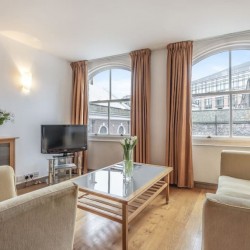 living room with large windows, sofas, table, tv, King's Apartments, City, London EC4