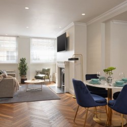 living room with dining area, sofa, shelves, and chair, Mayfair Deluxe Apartments, Mayfair, London W1