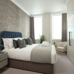 bedroom with cushions and towels, Mayfair Deluxe Apartments, Mayfair, London W1