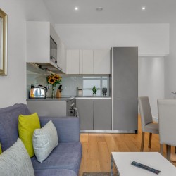 sofa with cushions, table, dining are and kitchen, Carlow Apartments, Camden, London NW1