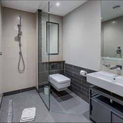bathroom with shower, WC, mirror, sink, Chancery Lane Apartments, Holborn, London W1C
