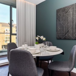 dining area with open door to balcony and art on the wall, Southern Apartments, North Kensington, London W10