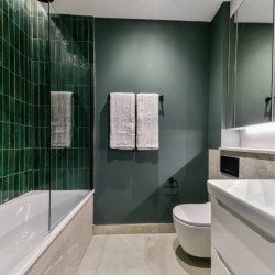 bathroom with bathtub, towel rail, toilet, sink and mirror, Southern Apartments, North Kensington, London W10