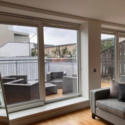 living area with sofa and view to large terrace with seating, Marylebone Apartments, Marylebone, London W1U