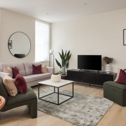 living room with 2 large chairs, sofa, side table with TC, wall mirror and print, Munster Apartments, Fulham, London SW6