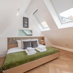 bedroom with king bed, towels, cushions and roof windows, Covent Garden Deluxe, Covent Garden, London WC2