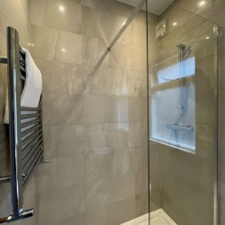 shower cubicle with towel rail, Barons Court Apartments, Hammersmith, London W6