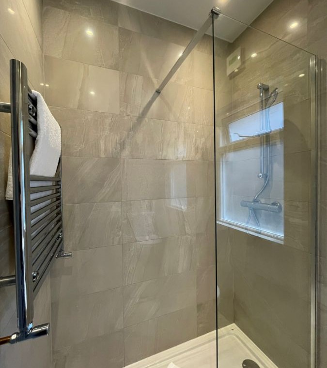shower cubicle with towel rail, Barons Court Apartments, Hammersmith, London W6