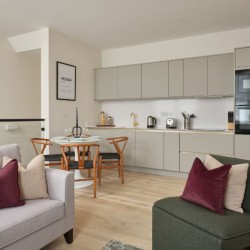 kitchen with dining table, sofa and chair, Munster Apartments, Fulham, London SW6