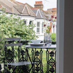 balcony with table and chairs, Barons Court Apartments, Hammersmith, London W6