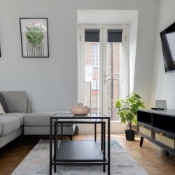 living area with sofa, table, side table and TV, Barons Court Apartments, Hammersmith, London W6