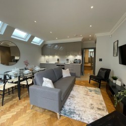 living area with sofa, dining area, kitchen and TV, Barons Court Apartments, Hammersmith, London W6