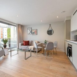 living room with chair, plant, glass table, sofa, dining table and kitchen, Southbank Apartments, Southwark, London SE1