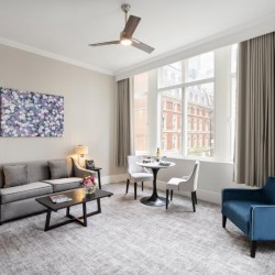 living room with sofa, side tables with lamp, dining area and chair, The Executive Residences, Tower Hill, London EC3