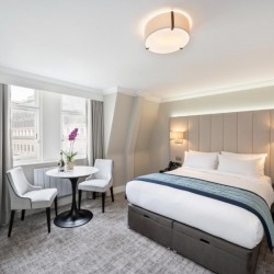 room with chair, dining area and double bed, The Executive Residences, Tower Hill, London EC3