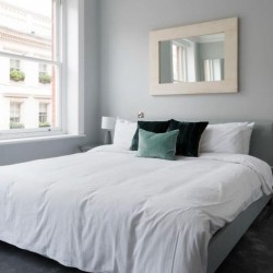bedroom with king size bed and mirror, West End Apartments, Holborn, London W1C
