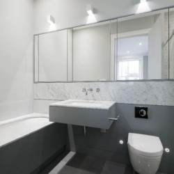 bathroom with bathtub, sink, WC and mirrors, West End Apartments, Holborn, London W1C